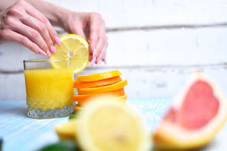 The orange in the handsの写真素材