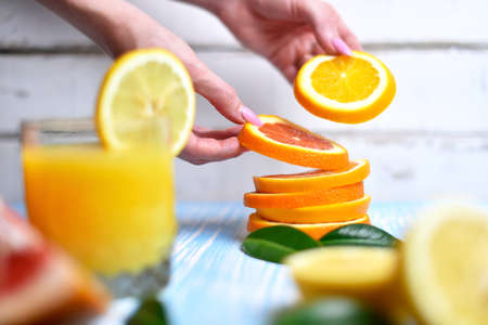 The orange in the handsの写真素材