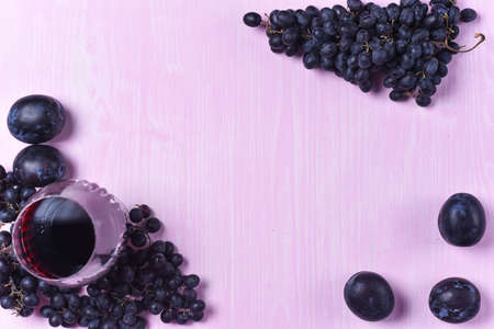 composition of wine, grape and plumsの写真素材