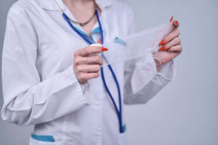 The doctor holds hands bandageの写真素材