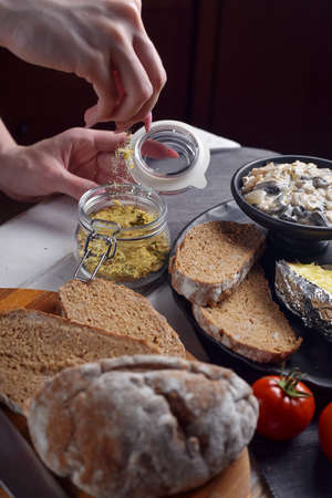 Preparation of potatoes with mushrooms and vegetablesの写真素材