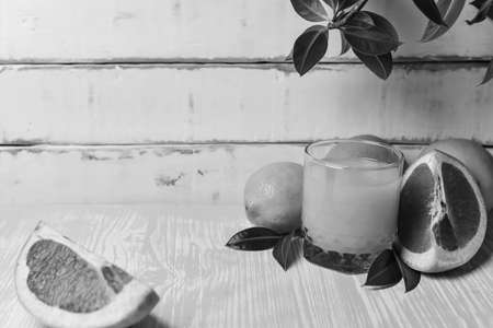 orange lying on a wooden tableの写真素材