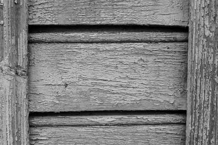 old paint on a dry wooden wallの写真素材