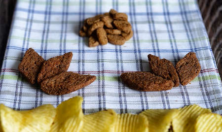 Salty snacks for beer on woodenの写真素材