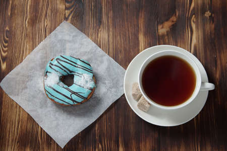 Sweet donuts on a dessert on a wooden background