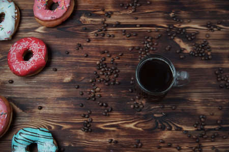 Sweet donuts on a dessert on a wooden backgroundの写真素材