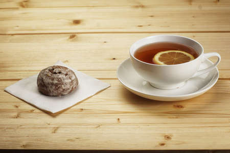 A cup of tea with lemon and ginger