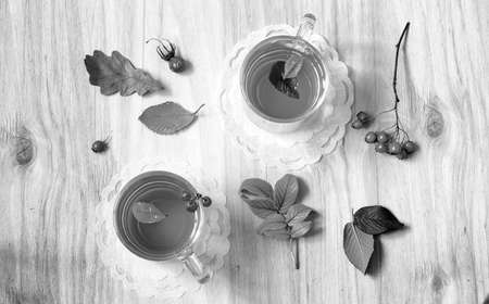 Tea in a glass cup on a wooden tableの写真素材