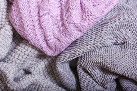 Autumn accessories knitted sweaters and leavesの写真素材