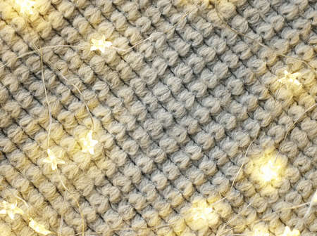 Christmas bright garlands on a wooden light backgroundの写真素材