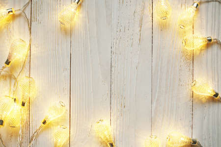 New Year background of bright garlands on a woodenの写真素材
