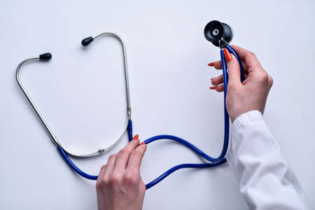 A stethoscope in the hands of the doctorの写真素材