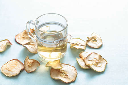 Dried fruits compote. Glass cups with drink from dried fruits, apples, meats, raisins with sugar. A...