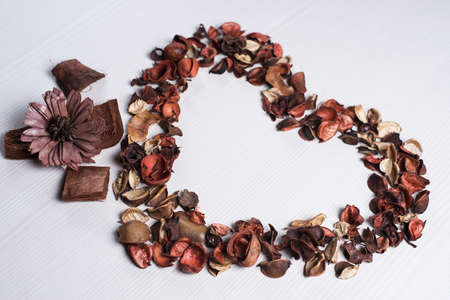 The frame of dried flowers on the tableの写真素材