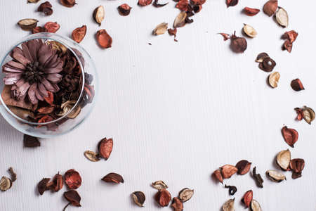 The frame of dried flowers on the tableの写真素材