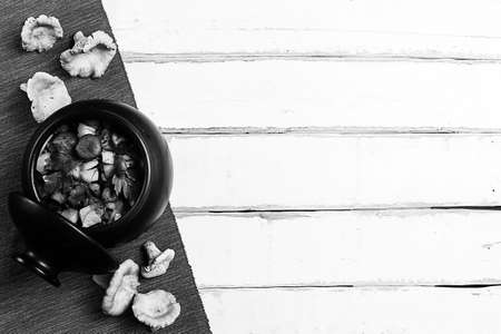 potatoes with mushrooms in a clay pot black and white poster