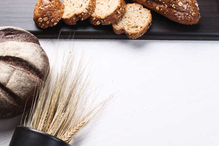 Fresh baked bread with ears on the tableの写真素材