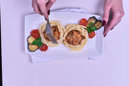 Italian pasta with meat in a cafe. Dinner in the restaurant. Hanの写真素材