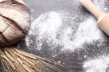 Fresh baked bread with ears of wheat. Wheat yellow. Breakfast isの写真素材