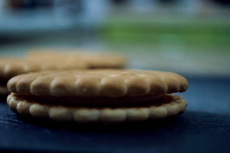 Cookies and milk on the kitchen table.
