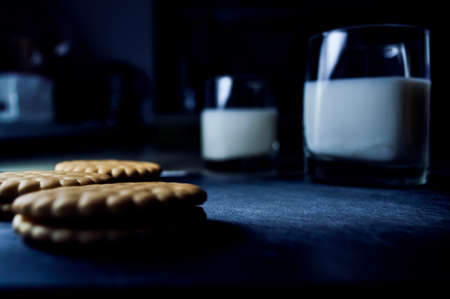 Cookies and milk on the kitchen table. Breakfast in the kitchenの写真素材