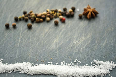 Sugar and salt spilled on the table.の写真素材