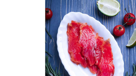 Fish sliced on the table for meals. Delicious seafood dinner.の写真素材