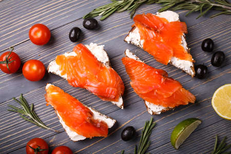 Sandwich of bread and salmon on the tableの写真素材