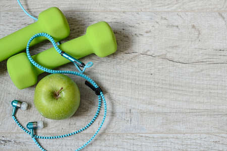 Fitness accessories. Sports dumbbells sneakers sports shoes andの写真素材