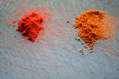 Eastern condiments scattered on a table at home. Turmeric and pe