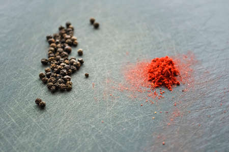 Eastern condiments scattered on a table at home. Turmeric and peの写真素材