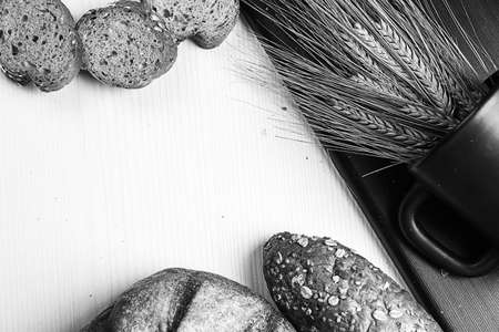 Fresh baked bread with ears of wheat. Wheat yellow. Breakfast isの写真素材