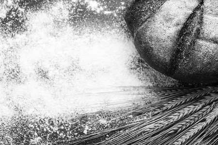 Fresh baked bread with ears of wheat. Wheat yellow. Breakfast isの写真素材