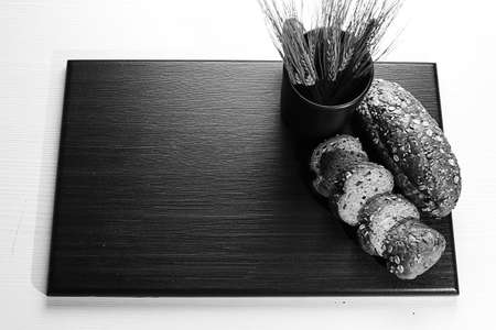 Fresh baked bread with ears of wheat. Wheat yellow. Breakfast isの写真素材