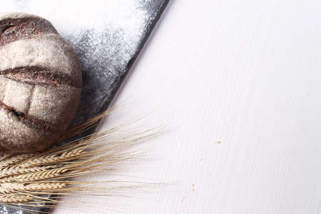 Fresh baked bread with ears of wheat. Wheat yellow. Breakfast isの写真素材