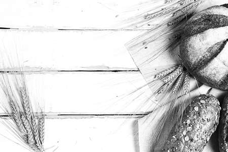 Fresh baked bread with ears of wheat. Wheat yellow. Breakfast isの写真素材