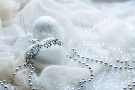 Christmas toys and balls to knit the scarf. Decorations on holidの写真素材