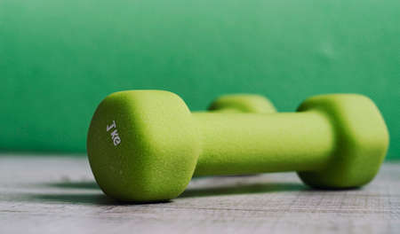 Fitness accessories. Sports dumbbells sneakers sports shoes andの写真素材