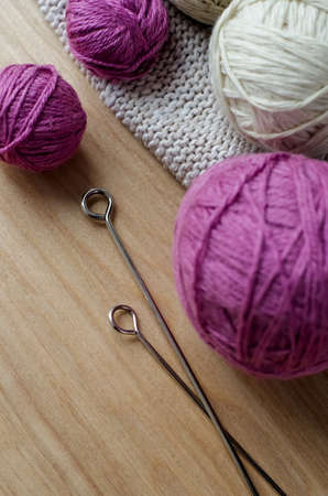 Balls of woolen yarn for knitting on the table. の写真素材
