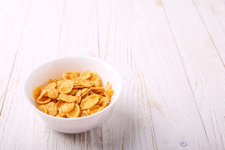 Cereal for Breakfast is on the table. Delicious rings from milk.の写真素材
