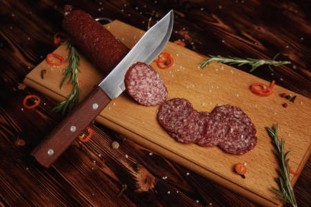 Smoked sausage on a wooden cutting board