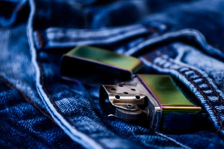 Denim clothes lying on the table with the glasses. Blue jeansの写真素材