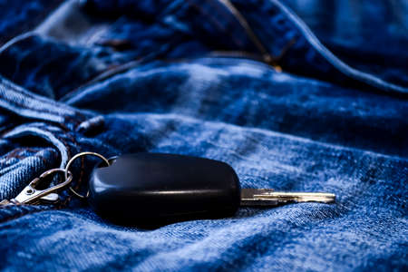 Denim clothes lying on the table with the glasses. Blue jeansの写真素材