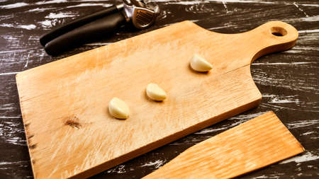 A composition of cloves of garlic on the table.の写真素材