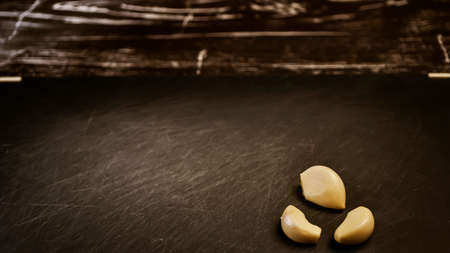 A composition of cloves of garlic on the table.の写真素材