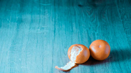 A composition of fresh mandarins on the table in the afternoonの写真素材
