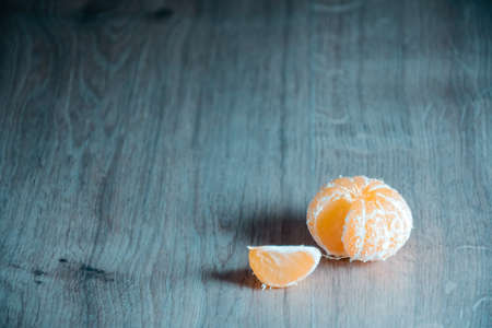 A composition of fresh mandarins on the table in the afternoonの写真素材