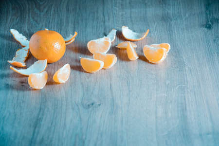 A composition of fresh mandarins on the table in the afternoonの写真素材