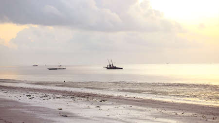 Boats in the ocean bay on a sunny afternoon. の写真素材