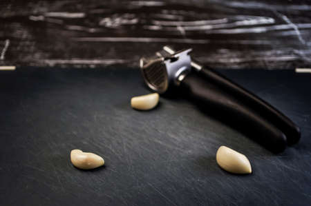 A composition of cloves of garlic on the table. の写真素材